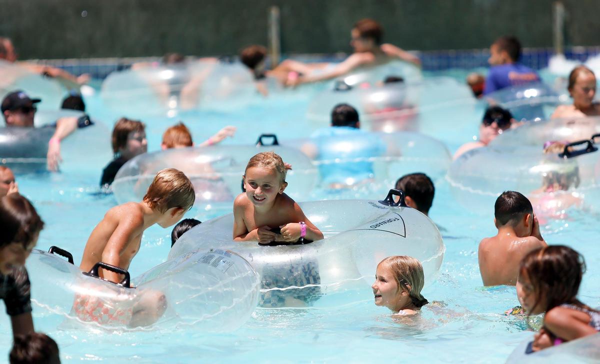 Kids play in the Calypso Bay Wave Pool at The Ravine Water Park in Paso Robles as temperatures hit the triple-digits on Thursday, July 27, 2023.