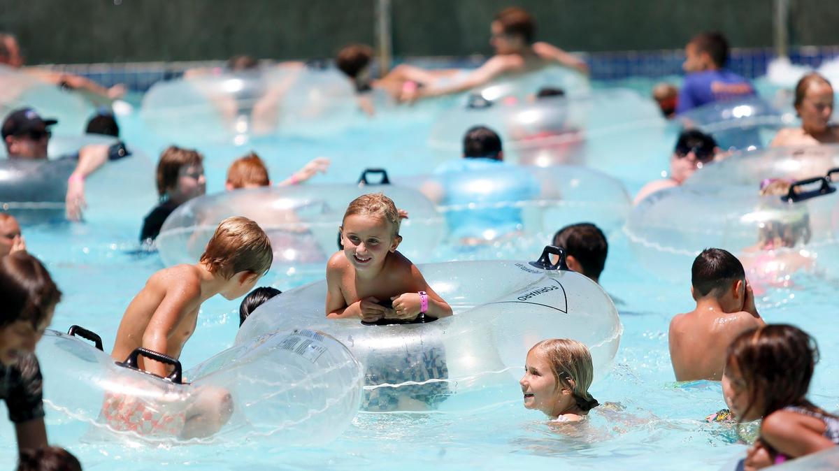 Kids play in the Calypso Bay Wave Pool at The Ravine Water Park in Paso Robles as temperatures hit the triple-digits on Thursday, July 27, 2023.