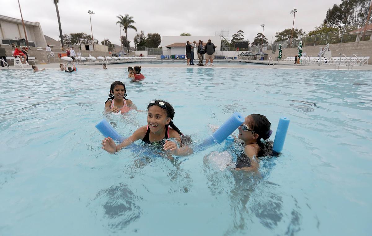 From left, Cristina Calvario, 10; Lilly Renteria, 10, and Ava Navarro, all from San Luis Obispo, play at the Cuesta College pool.