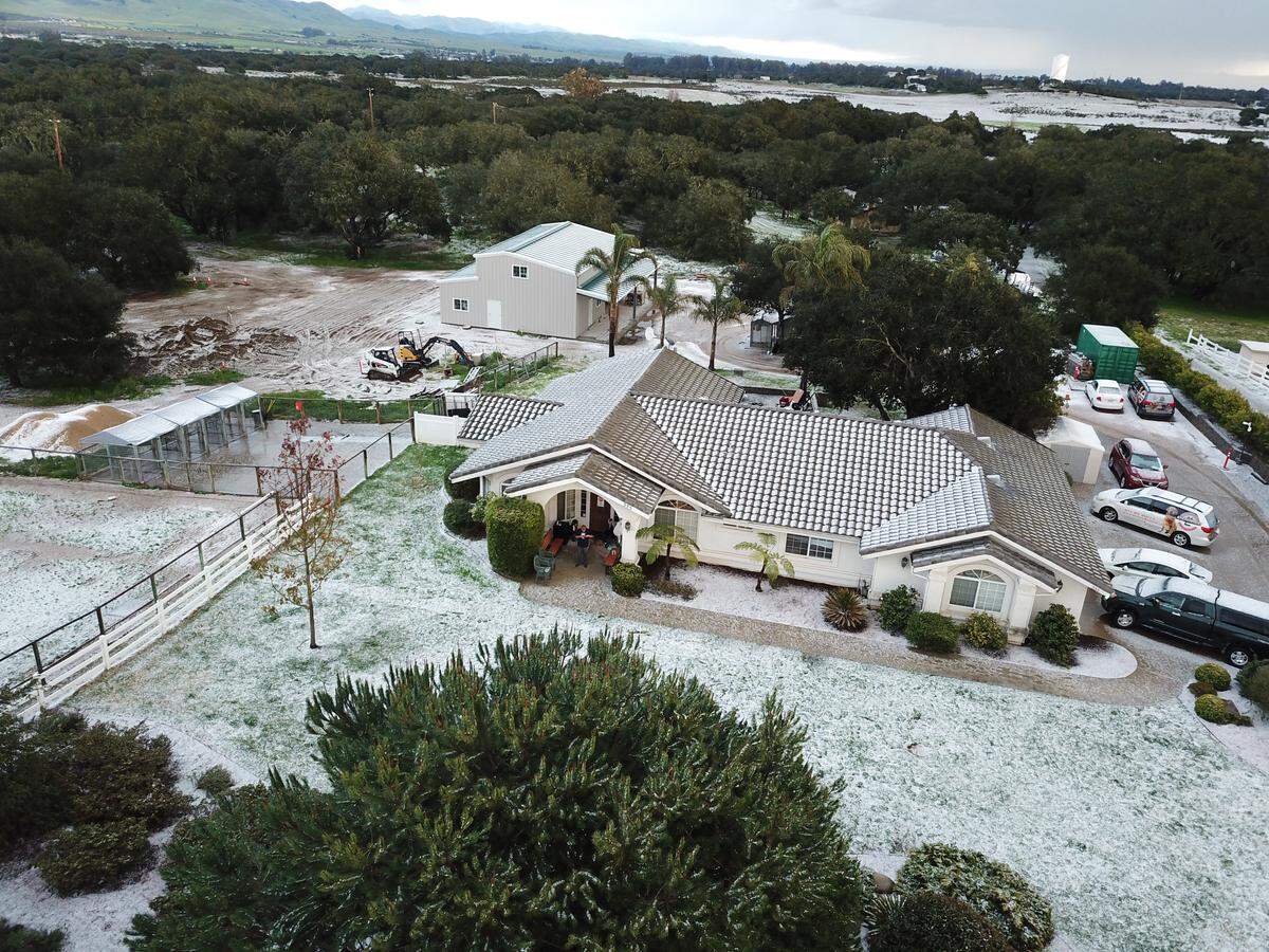 Drone footage of the hail covering the ground in Arroyo Grande at Doggie Do Good on Summit Station.