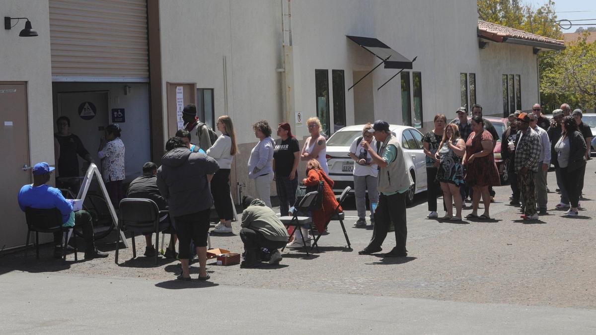 People line up for shoes at the Transitions-Mental Heath Association offices in San Luis Obispo on April 30, 2024. Vans and TMHA gave away 1,500 free pairs of shoes.
