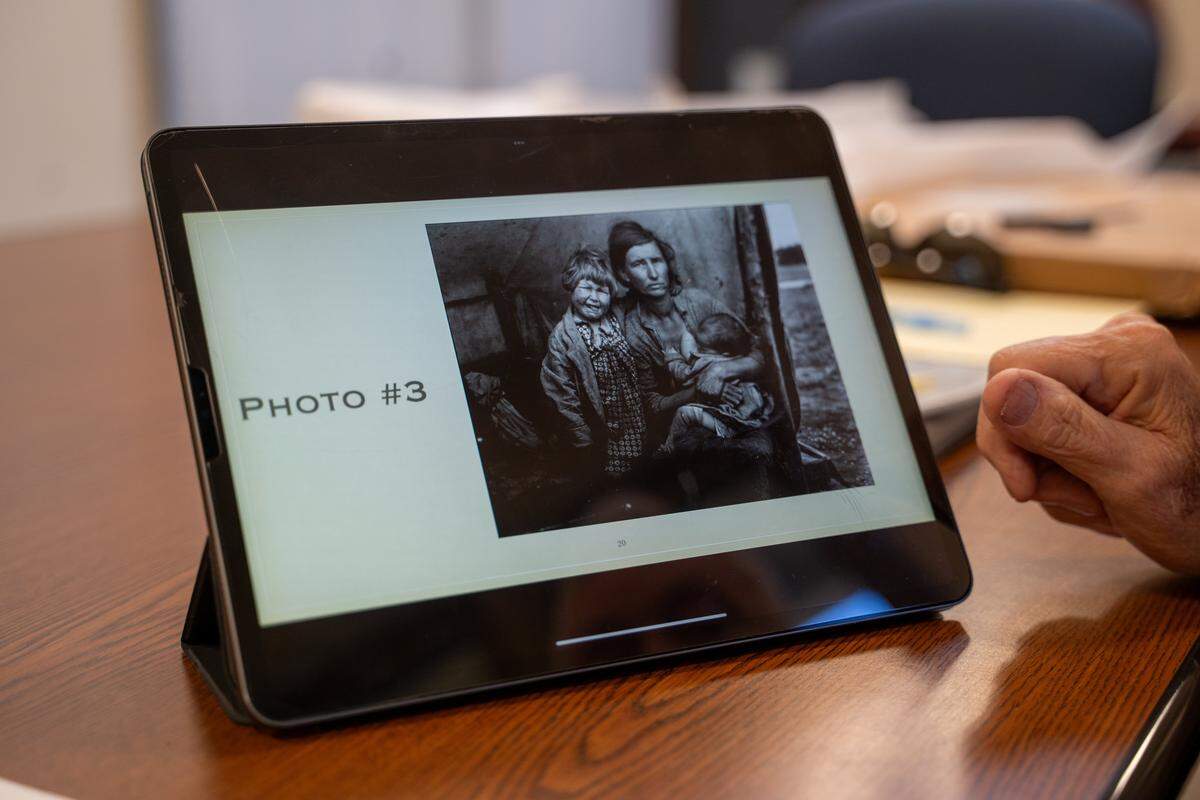 Former Judkins Middle School social studies teacher and Dana Adobe & Cultural Center docent Terry Handy points out another photo by Dorothea Lange from the “Migrant Mother” session on Friday, Oct. 24, 2025. The plaque will be unveiled to the public on Nov. 15 at Jim Miller Park in Nipomo.