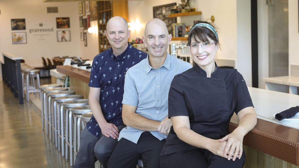 From left owners of Gravesend Wine Merchant & Eatery Matt Reese and Keith Robinson and chef Amy Baer seen here on Aug. 19, 2025.