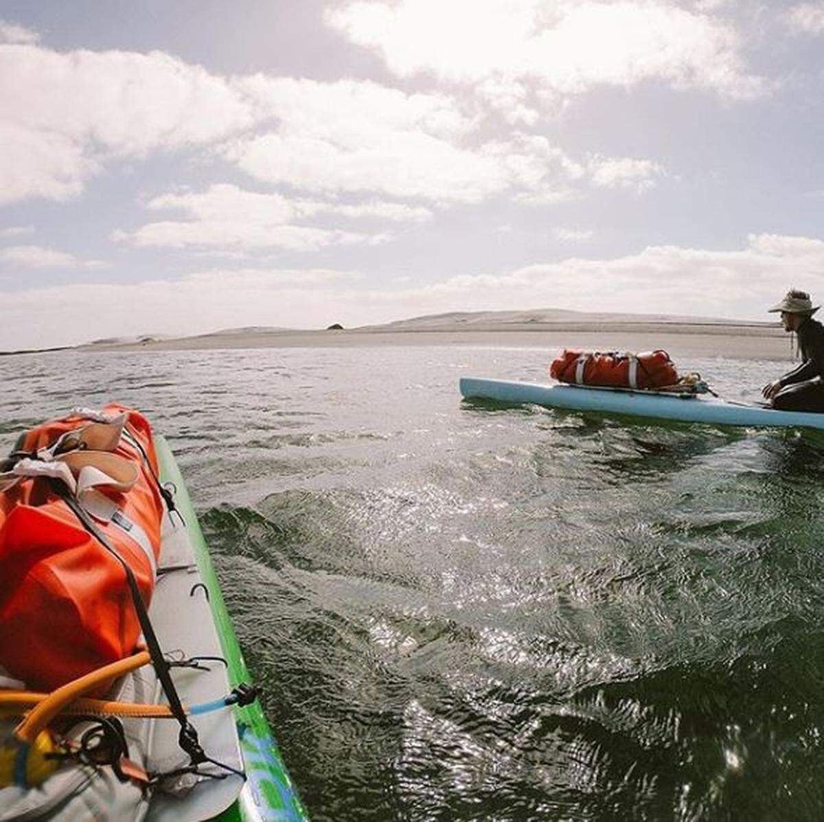 Ryan and Casey Higginbotham of Pismo Beach on their paddleboards off the shore of Baja California, Mexico, during their 1,100-mile journey from the U.S. border to Cabo San Lucas.
