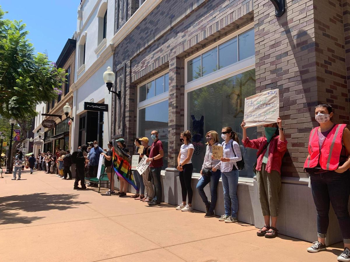 Protesters have lined up along businesses surrounding Giuseppe’s and Finney’s outdoor dining parklets. Protesters are remaining silent and staying out of doorways of businesses.