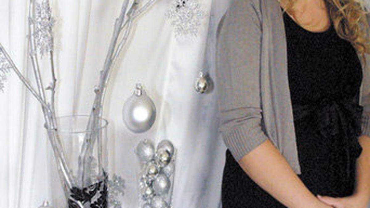 Shelli Palma, owner of Palma Home Design, with a holiday-themed display in her Nipomo showroom.