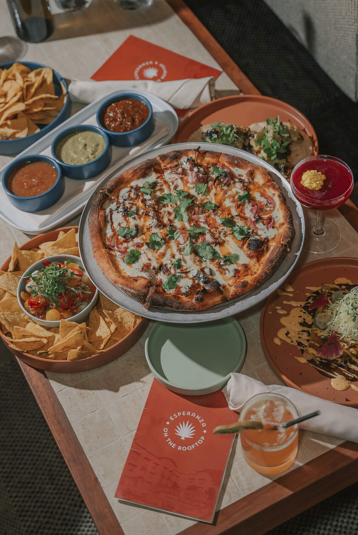 Esperanza’s menu features casual rooftop fare alongside craft cocktails and zero-proof beverages, giving guests a relaxed setting to gather before or after exploring downtown.