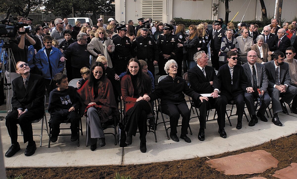 The audience reacts to earthquake at a memorial remembrance ceremony held for Arroyo Grande police officer Richard Berry when a 6.5 magnitude earthquake struck at 11:16 am.
