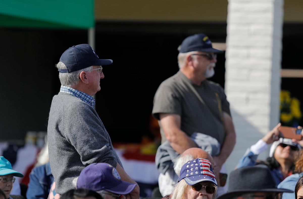 A Veterans Day celebration was held at the Los Osos Valley Memorial Park, Friday, Nov. 11, 2022. Harry Roger Holden, left, a U.S. Navy veteran, and another Navy veteran stood when the San Luis Obispo County Band played “Anchors Aweigh,” which is the fight song for the Navy.