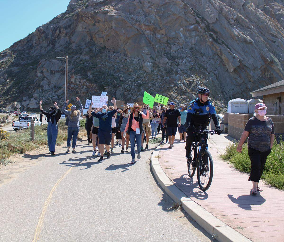 About 100 to 200 people gathered in Morro Bay to protest on Saturday.