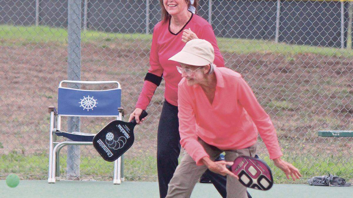 Trish Davega, in red, and Karen Frair team up in a pickleball game on the Coast Union High School courts Sunday, Aug. 9.