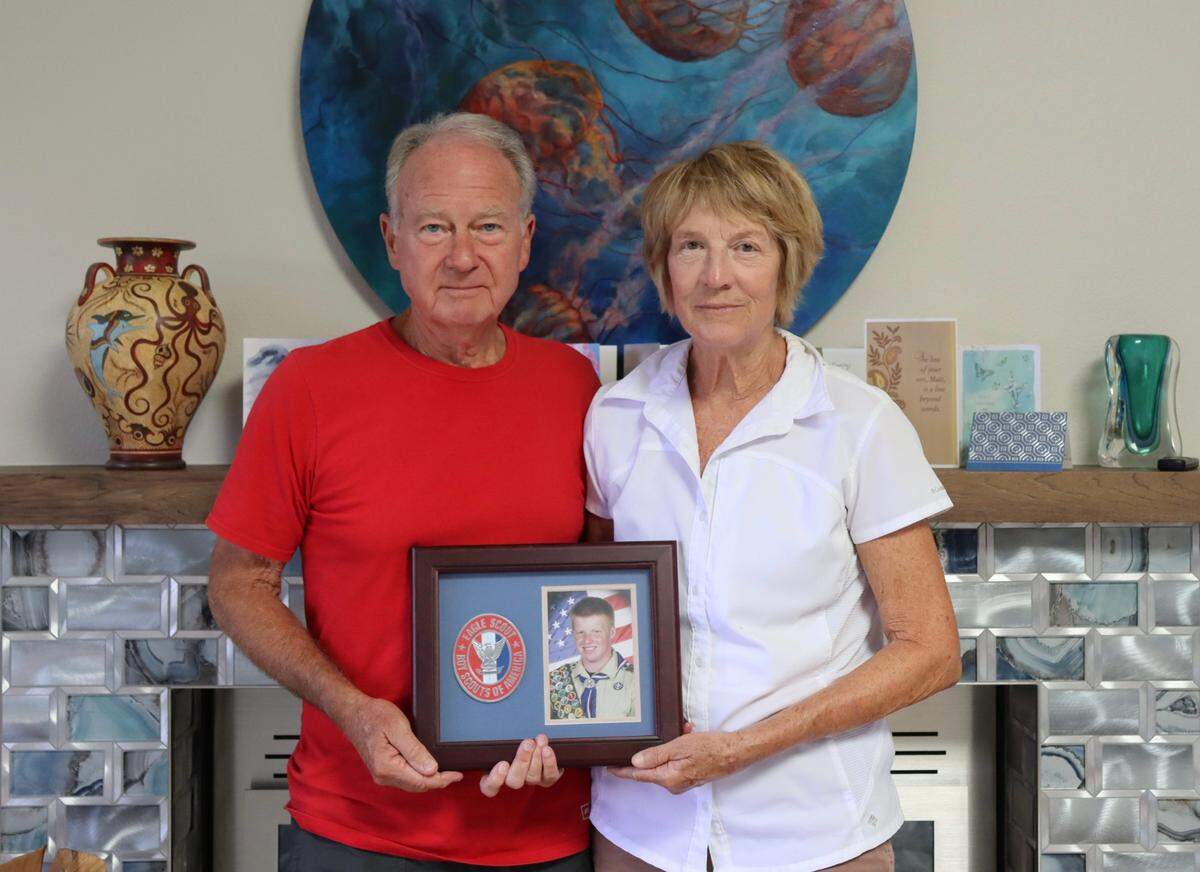 Marc and Becky Bowen hold a picture of their son, Matthew Bowen, in his high school Eagle Scout uniform on July 18, 2024 in Pismo Beach. Bowen, 32, died after being hit by a suspected DUI driver in Vacaville on July 11, 2024.