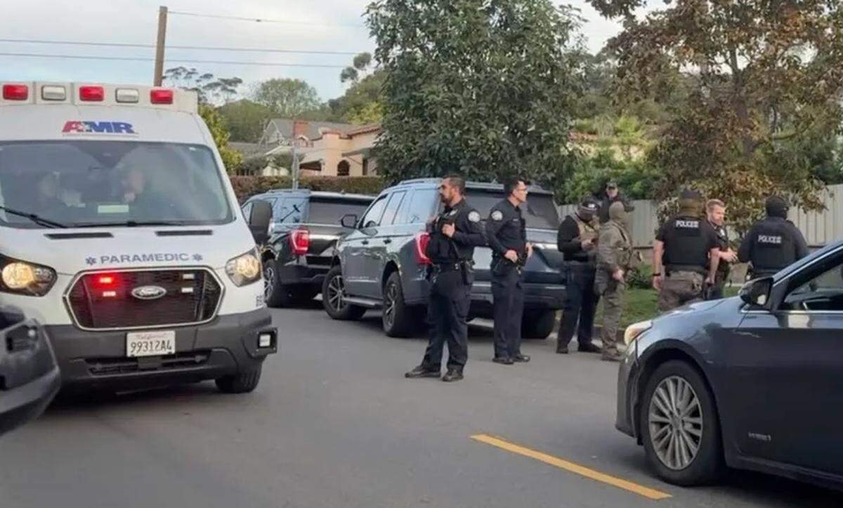 Santa Barbara Police uniformed officers, center, and paramedics responded to the Eastside on Jan. 28, 2026, after a federal agent pepper sprayed a person in the face and another person was pushed by an agent.