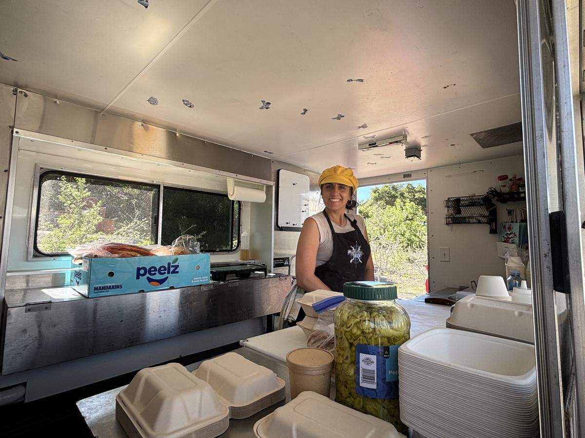 Brittany Gonyer, owner of Wandering Eats food truck, works an event at Peacock Cellars in Arroyo Grande.