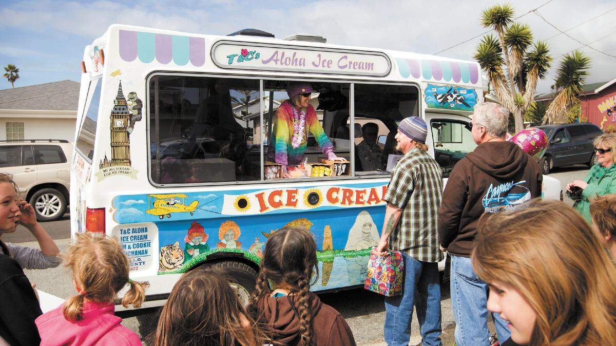 Jodi Fisher hands out free ice cream from a truck in Cayucos for her birthday.