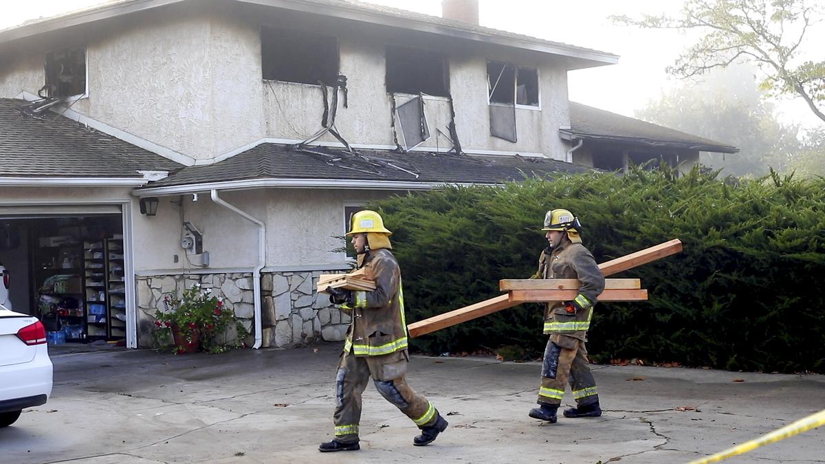 Firefighters work to shore up a partially collapsed second floor so investigators can work safely after an early-morning fire killed one person and injured two others in Nipomo on Tuesday, Nov. 2, 2021.
