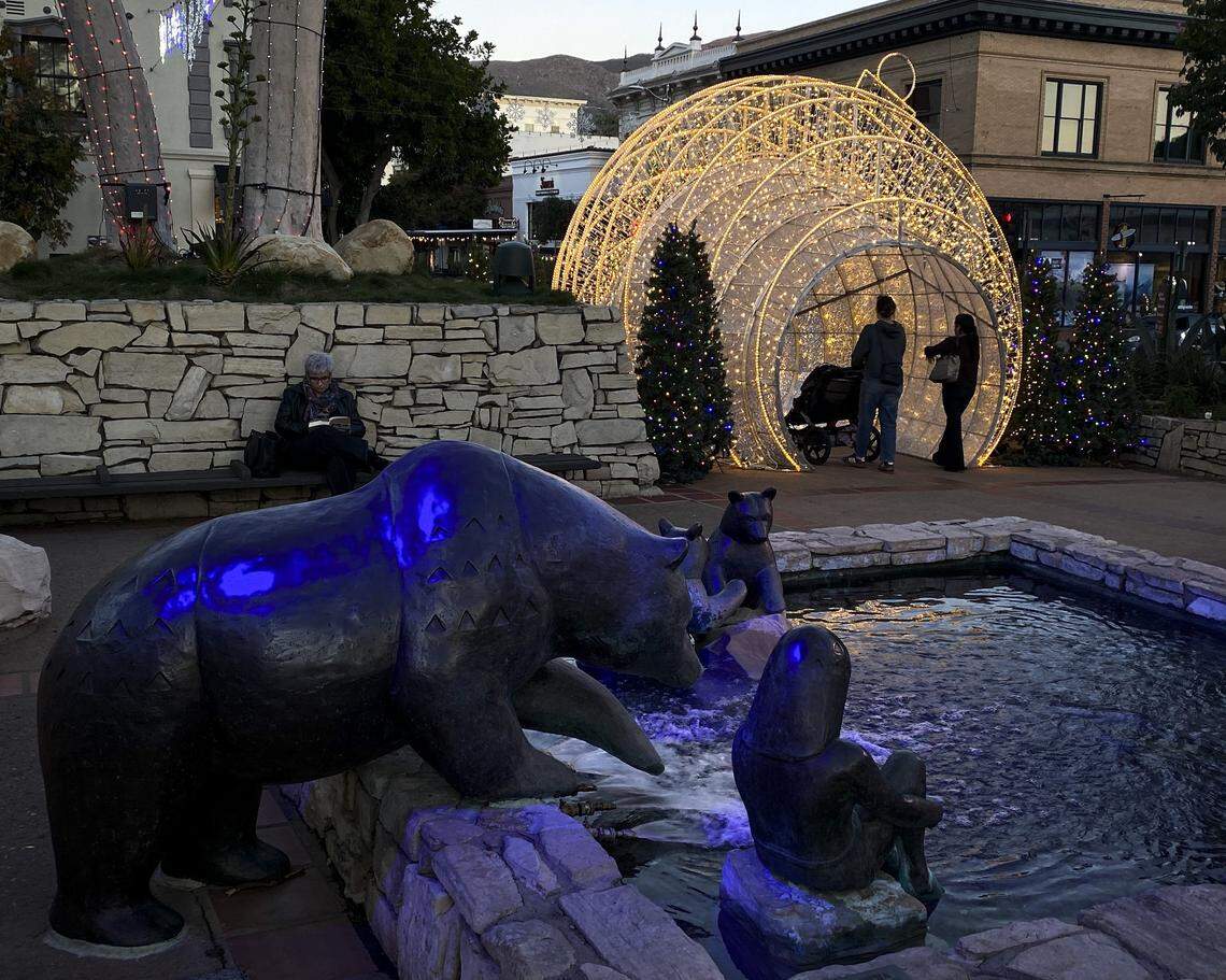 The giant ornament is lit at the entry to San Luis Obispo's Mission Plaza. Holiday season is lighting up the night on Dec. 1, 2025.