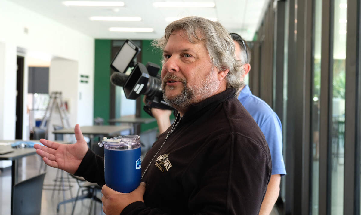 Retired Cal Poly athletic director Don Oberhelman speaks with media representatives during a tour of the newly unveiled John Madden Football Center on June 5, 2026.