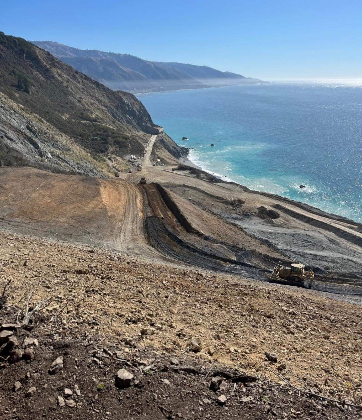 Crews continue to build up the elevation of the south end of Paul’s Slide on Highway 1 to Big Sur for what will be the new course of the roadway after winter storms cause the hillside to collapse. Caltrans shared this photo on Nov. 14, 2023.