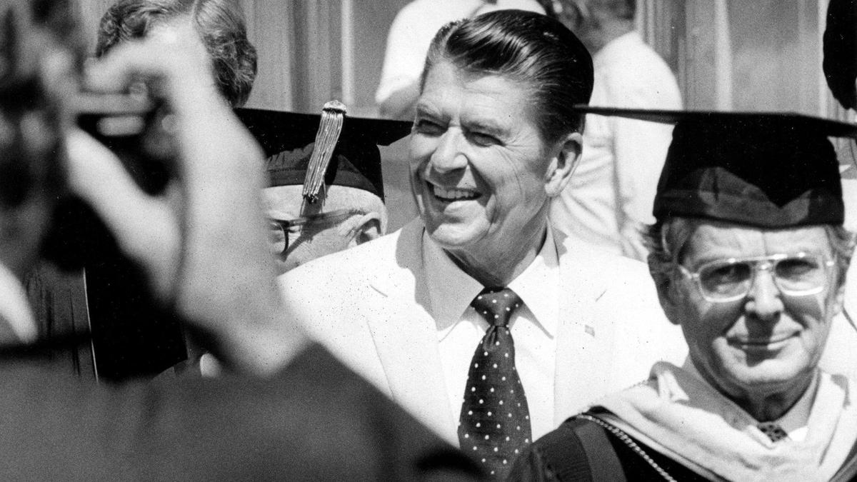 A spectator gets in a quick snapshot as Governor Ronald Reagan, center, and Cal Poly President Robert Kennedy, right, enter the graduation field June 17, 1974. The governor’s visit was a measure of how far Cal Poly had come, four decades earlier the state legislature was cutting budgets and the campus was at risk.