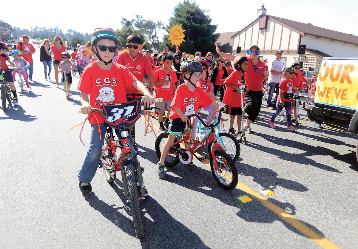 Cambria Grammar School kids ride bikes and look cool in shades at Cambria’s Pinedorado Parade in 2019. The 2021 Pinedorado festival was canceled.
