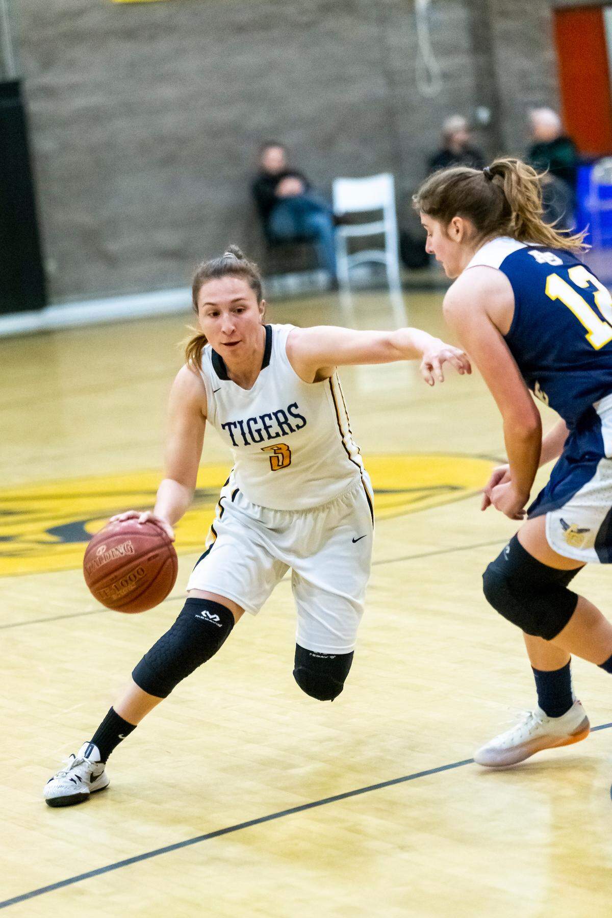 San Luis Obispo High School guard Lily Svetich drives around an Arroyo Grande defender in the teams’ Jan. 15 game.