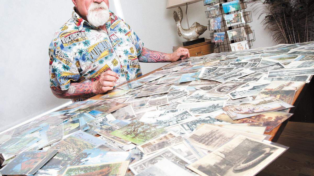 Steve Howell with a small sampling of his postcard collection.