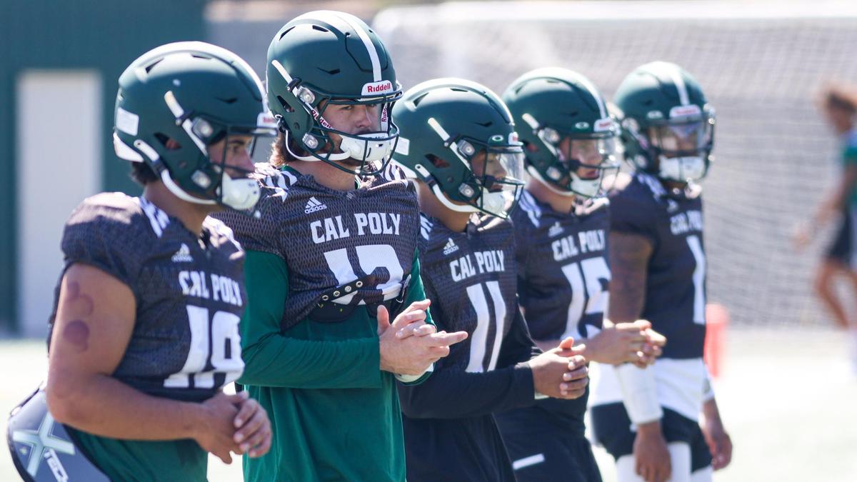 Cal Poly quarterbacks, from left, include Bo Kelly (18), Spencer Brasch (13), Jaden Jones (11), Bryce Weiner (15) and Kahliq Paulette (1). The Cal Poly football team was prepares for its 2022 season opener on the practice field Aug. 29, 2022.