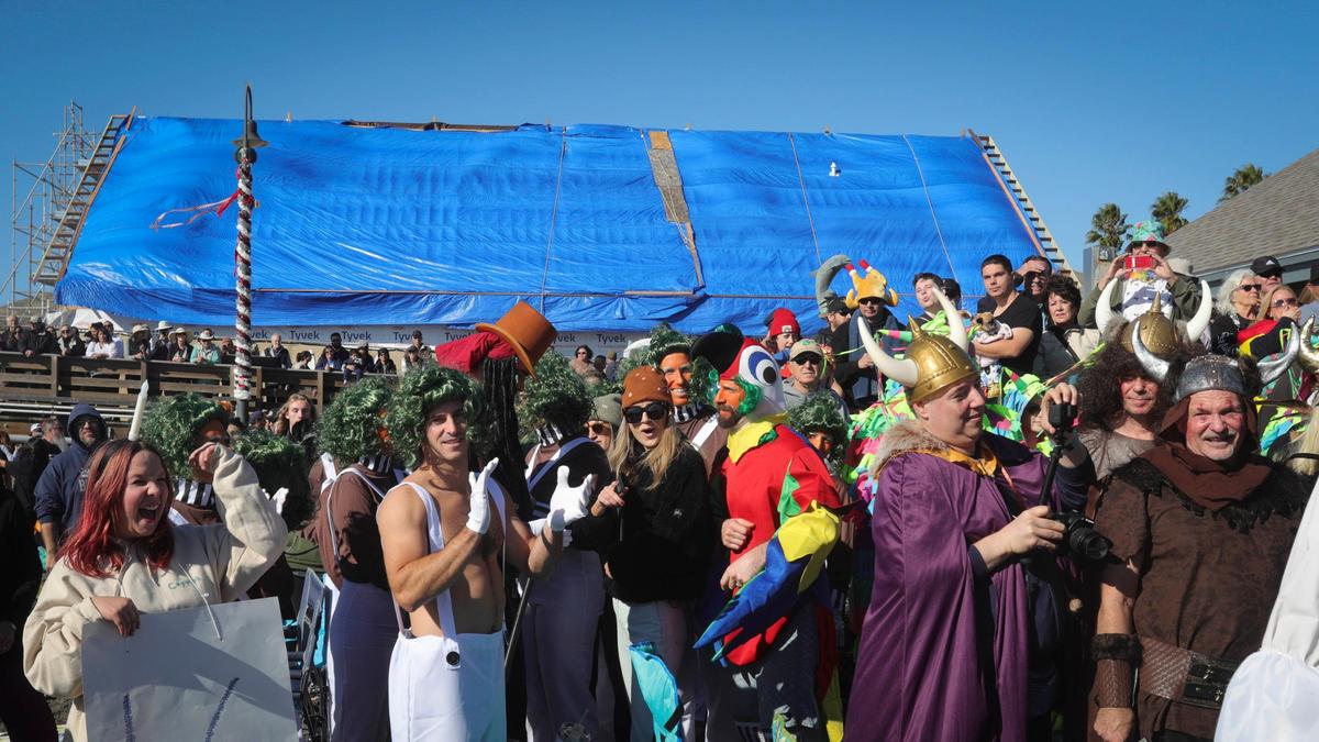 Costumed participants gather for the annual contest before the plunge at noon. About 1,000 people celebrated the New Year plunging into the surf at Cayucos at the 44th annual Carlin Soulé Memorial Polar Bear Dip on Jan. 1, 2024.