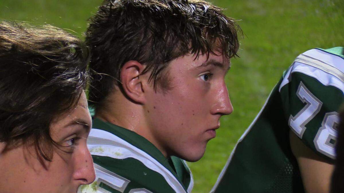 Walker Craven (middle) during a football game for Templeton High.