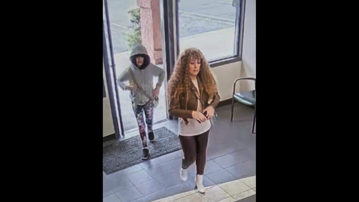 Melodee Buzzard, left, and her mother, Ashlee Buzzard, appearing to wear wigs inside a car rental shop in Lompoc on Oct. 7 before embarking on a road trip to Nebraska. The Santa Barbara Sheriff’s Office said 9-year-old Melodee did not return from the road trip.