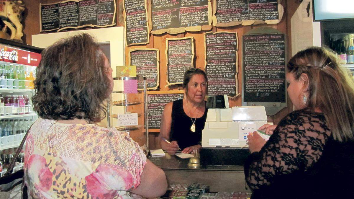 Abbey Lucas greets customers at the new Cafe on Bridge Street.