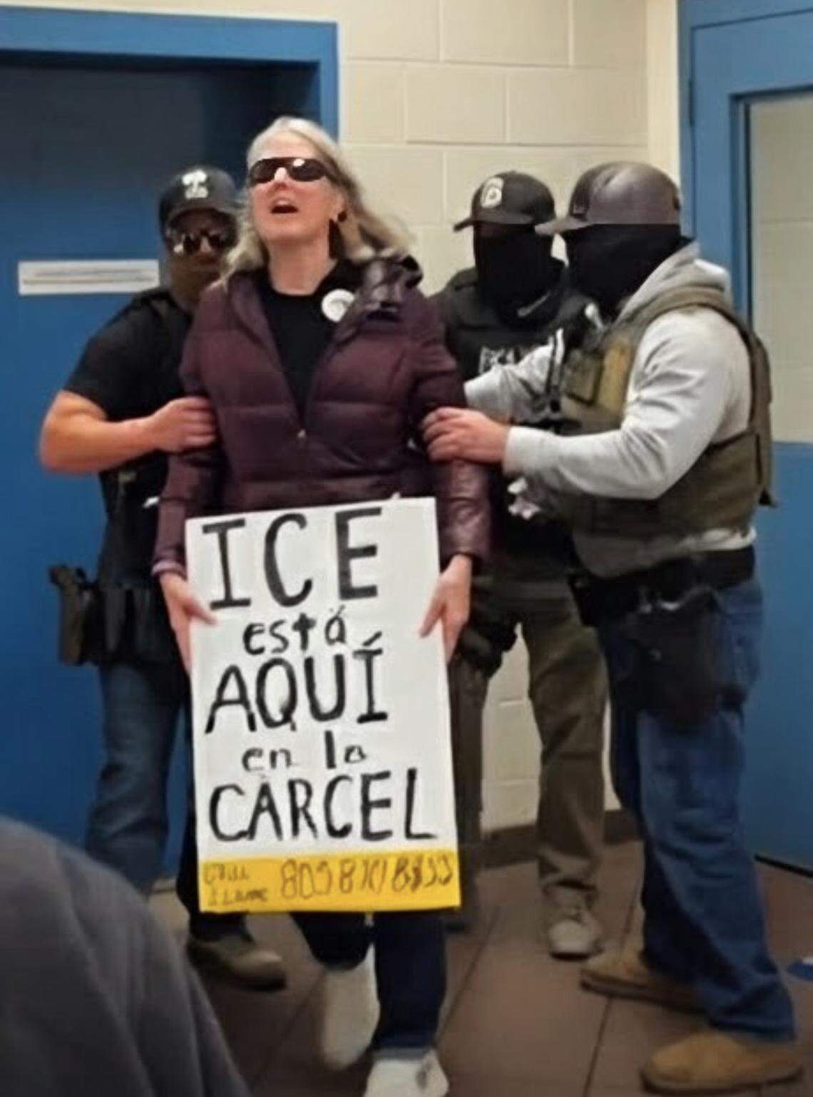 ICE agents grabbed protester Sue M. and pushed her away from the jail release door on Dec. 14, 2025.