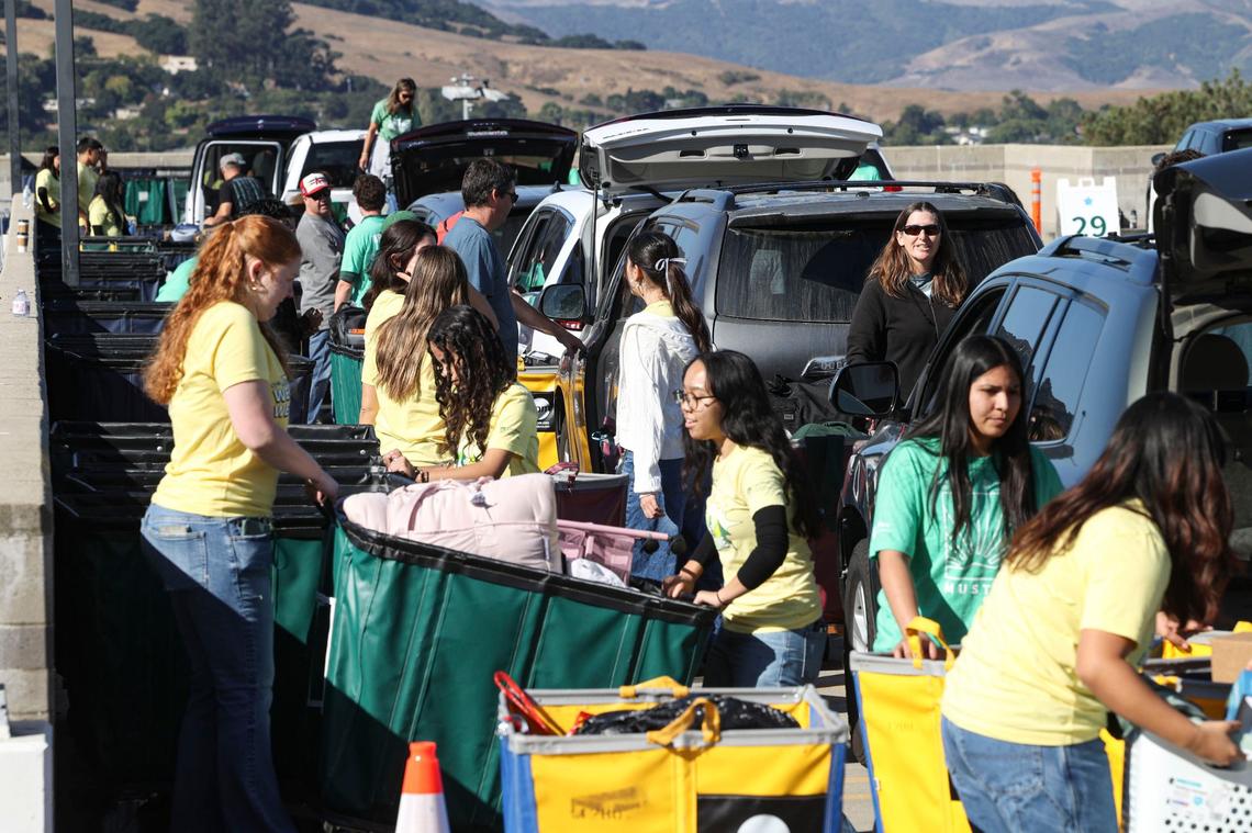 Cal Poly Staff and students assisted parents and incoming students unload cars as the first of three days of move in take place on the Cal Poly campus on Sept. 17, 2024. Over 5,000 incoming freshmen are part of incoming new students in San Luis Obispo.