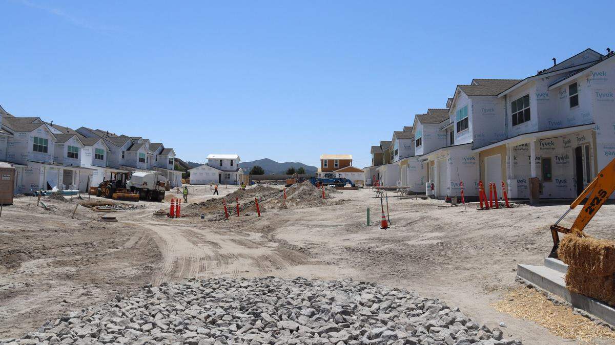 A 70-unit housing development at 10850 El Camino Real in Atascadero has led to disputes with neighbors over slow progress. Several unfinished houses line the sand lot at the work project. Neighbors said that in the five years the site has been there, they haven’t seen more than a few workers on-site at a time.