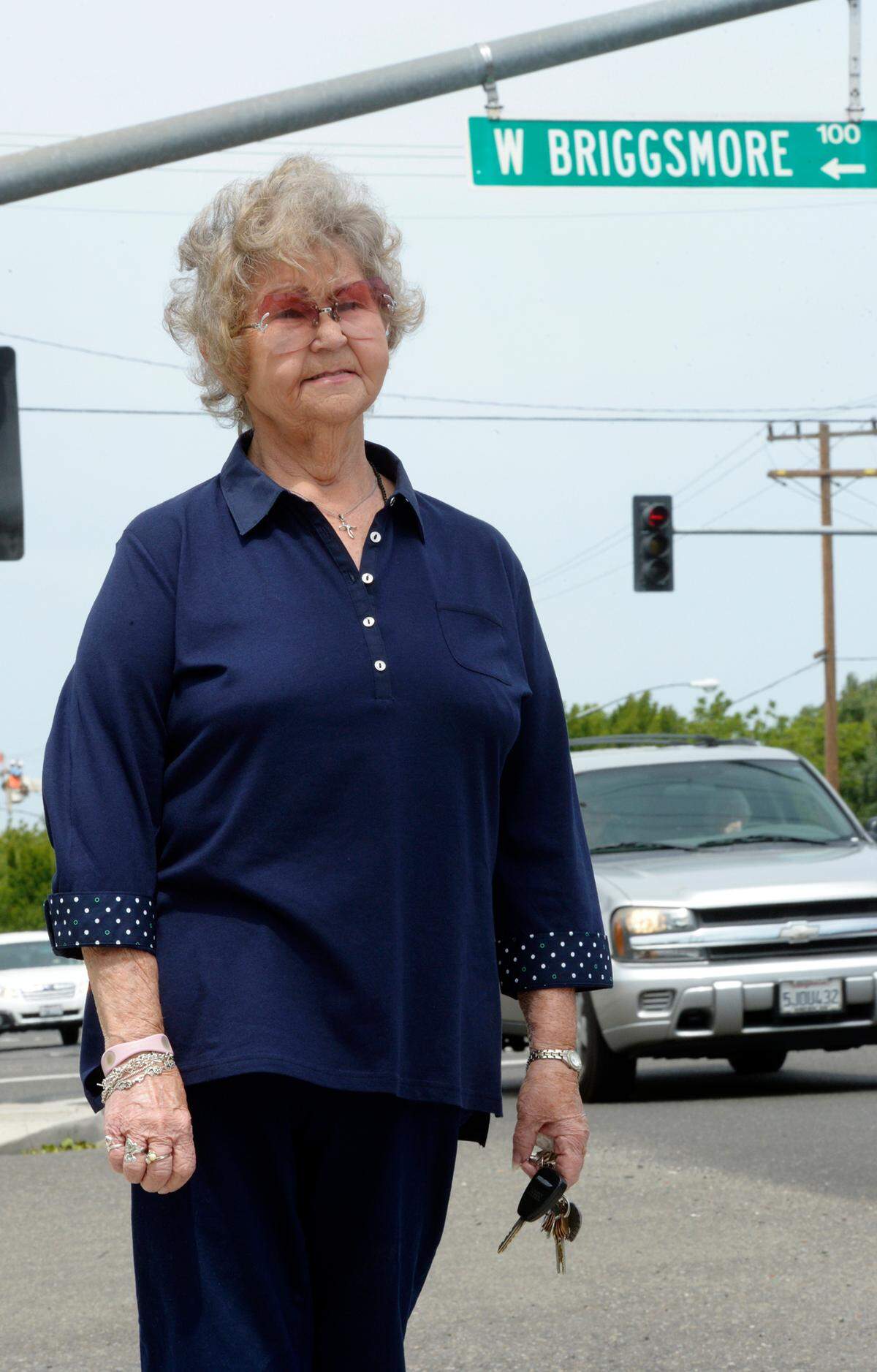 Elaine Ixcot, 76, of Modesto stands by the busy intersection of Briggsmore and McHenry avenues in Modesto in 2014. Her aunt and uncle, Rose and Russell Briggs, lived on the northwest corner of those streets.