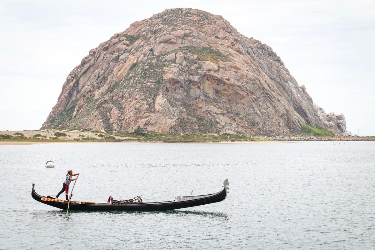 Central Coast Gondola owner Stephen Anastasia rows on the waters of Morro Bay in the Gianna, an elaborately carved and decorated Venetian wedding gondola, on Thursday, June 22, 2023.