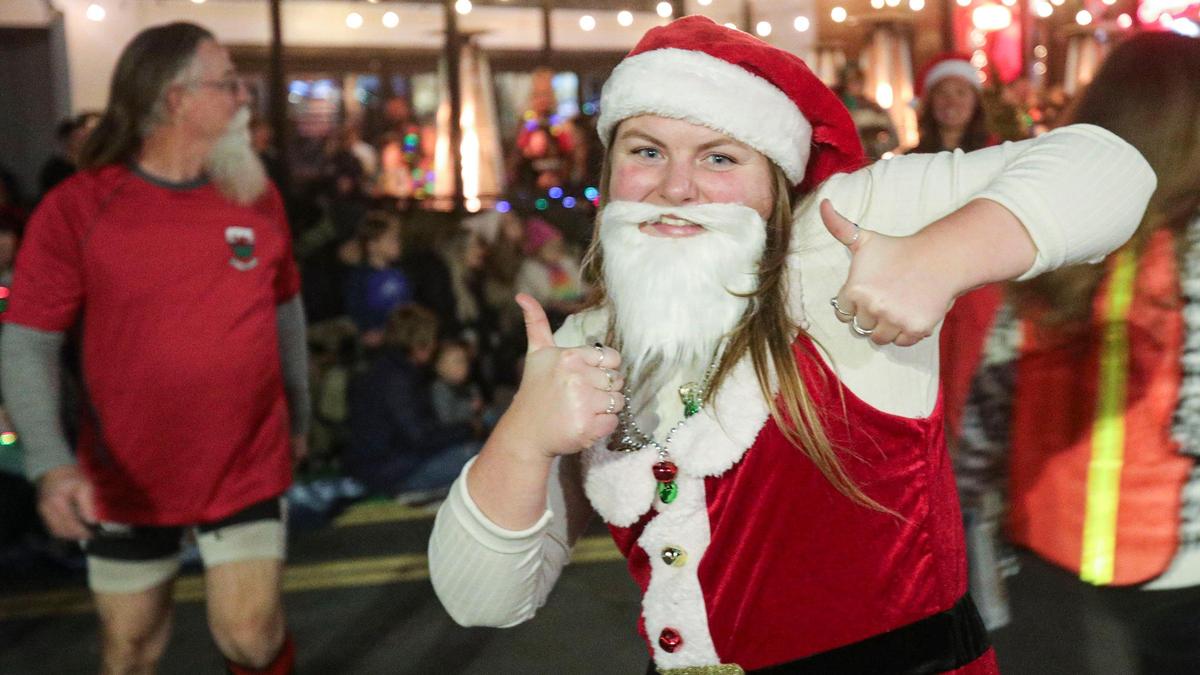 Morgan Moulis with SLO Rugby dressed up as Santa for San Luis Obispo’s 47th Annual Downtown Holiday Parade on Dec. 1, 2023.