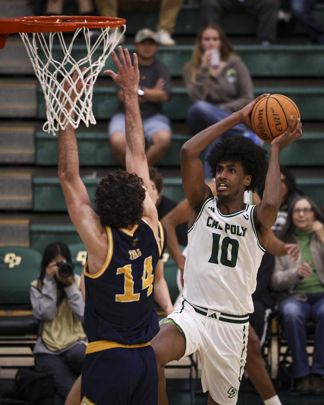 Hamad Mousa shoots over Kyle Evans. Cal Poly men scored an upset basketball victory over U.C. Irvine 79-73 on Feb. 12, 2026.