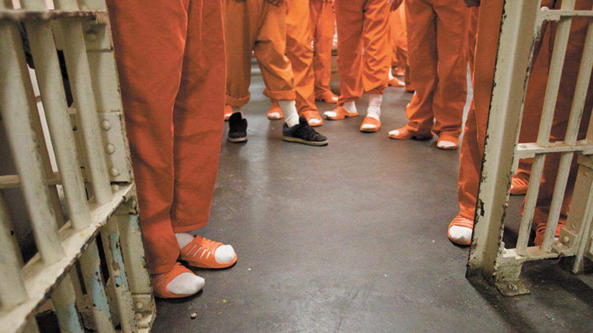 County Jail inmates prepare to leave the main dorm for a search of the room in 2012. The unit had 47 residents that day but has a maximum capacity of 62.