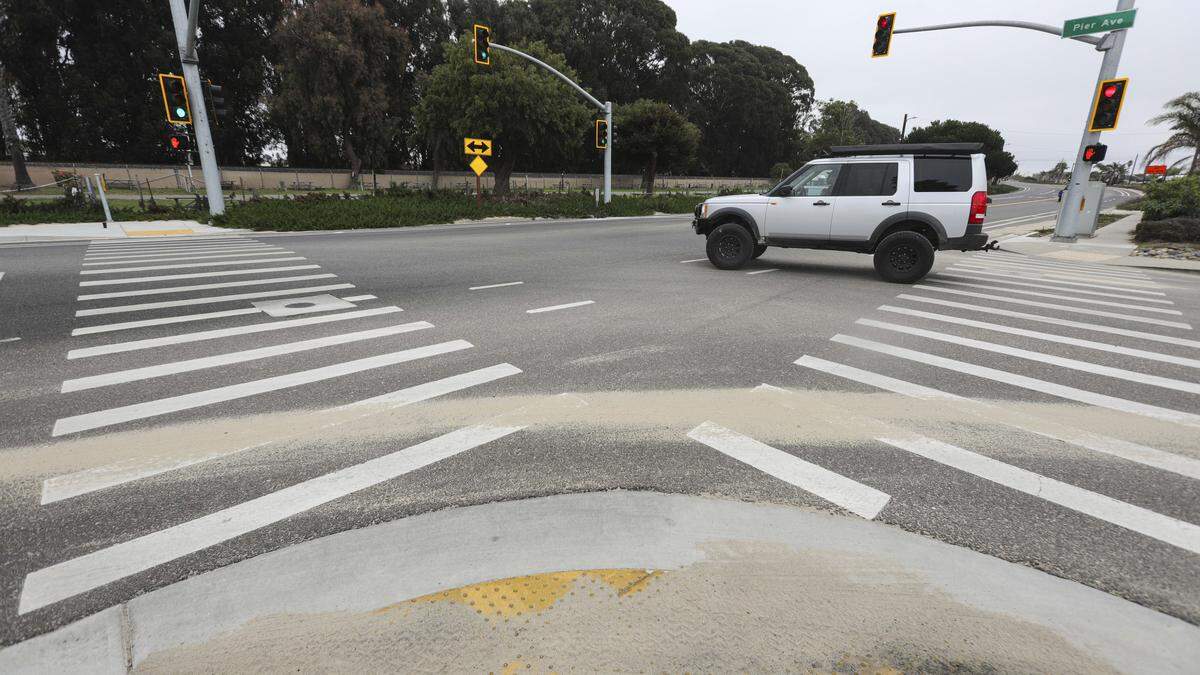 Sand is scattered at the Highway 1 and Pier Ave intersection. Changes are proposed for Pier Ave. in Oceano, seen here on Oct. 6, 2025.