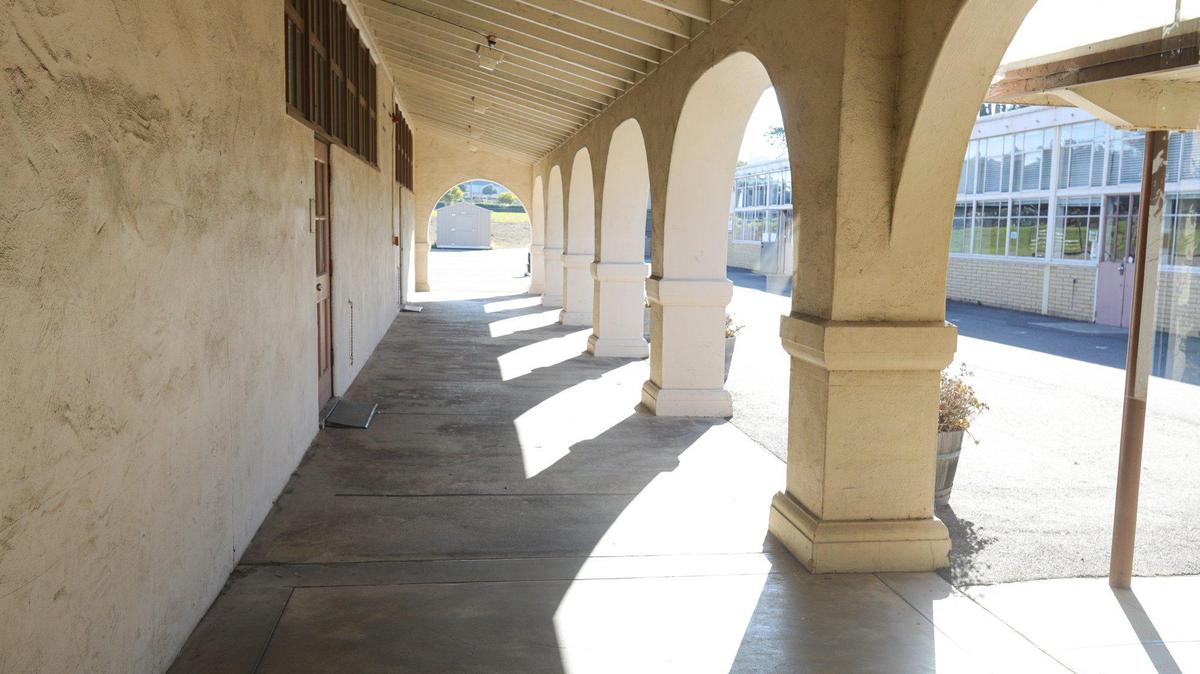 Sunshine lights up an outside hallway on the campus of the former Morro Elementary School.