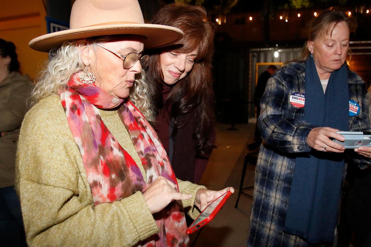 Paso Robles City Council candidate Kris Beal held an Election Night watch party at The Backyard on Thirteenth on Nov. 5, 2024. Beal, left, checks results with friends Melissa Chavez and Linda Wilson and Glenna Thompson, all of Paso Robles.