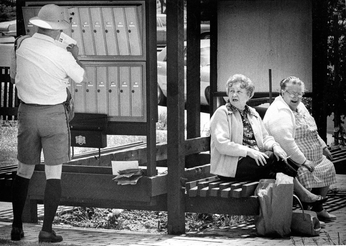 The look of dismay on one face, and the hearty laughter on another reveal a sensitivity to the appearance of one of San Luis Obispo postmen on June 1, 1974. The shorts and knee socks are cooler in warm climes, especially to men like Bert Williams, who must be out in the sun for long periods every day.