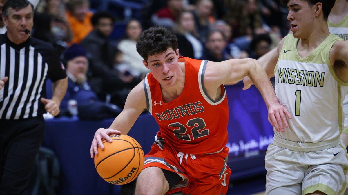 C.J. Bell dribbles around Maddox Contreras. Mission Prep basketball team won 72-31 over Atascadero Jan. 6, 2023.