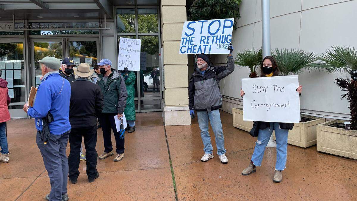 Protesters gathered outside the Board of Supervisors Chambers in December, as the Board of Supervisors voted to adopt a controversial redistricting map.