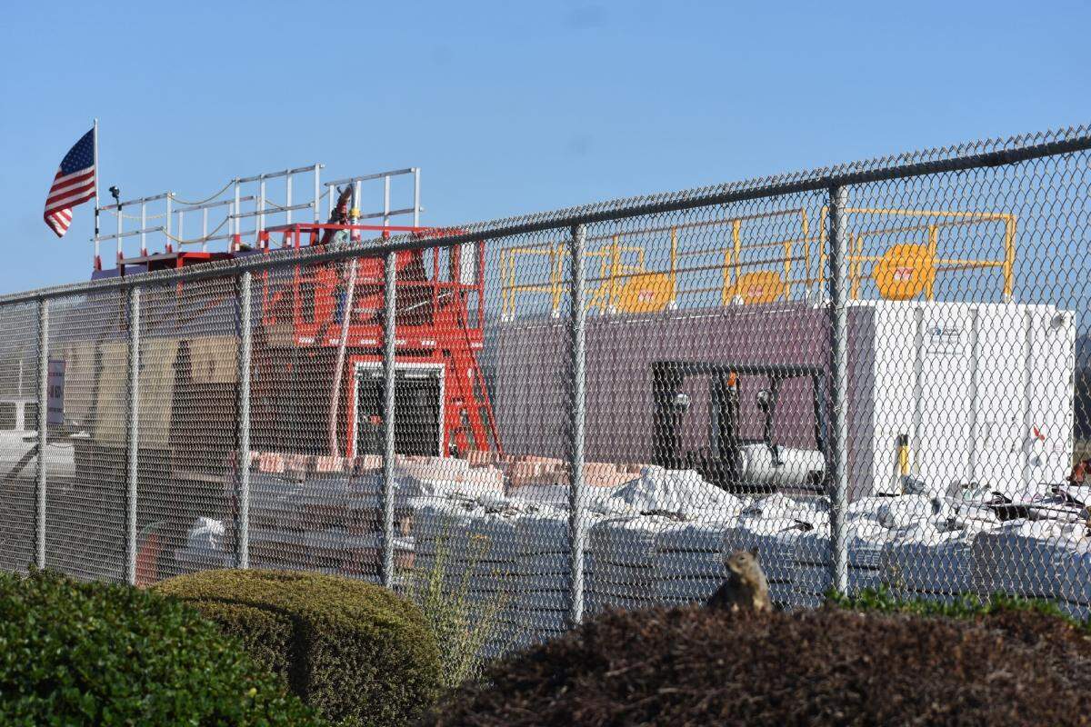 A squirrel sits outside the fence at the Santa Maria Public Airport, where fire retardant supplies await. Officials recently announced expanded capabilities for the air tanker base.