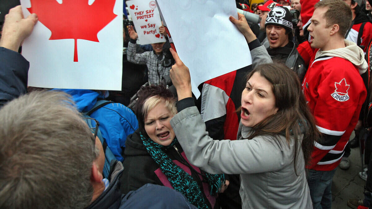 Anti-Olympic protesters exchange viewpoints with pro-Olympic activists during a rally at the Vancouver Art Gallery in Vancouver, Canada, on Friday, February 12, 2010. (Mike Siegel/Seattle Times/MCT)