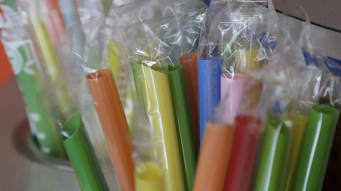 This July 17, 2018 photo shows wrapped plastic straws at a bubble tea cafe in San Francisco.
