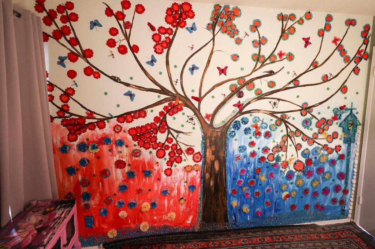 A tree mural is accented with mosaic tiles in a bedroom in the San Luis Obispo home owned by Bruce and Suki Mason, seen here on May 10, 2024.